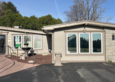 Front view of Soul Craft Coaching & Wellness in Lapeer, Michigan, US with a serene fountain and entrance.