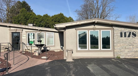 Front view of Soul Craft Coaching & Wellness in Lapeer, Michigan, US with a serene fountain and entrance.
