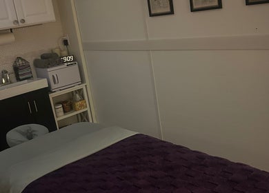 Relaxing room at Soul Craft Coaching & Wellness in Lapeer, Michigan, US, with sink and massage bed.