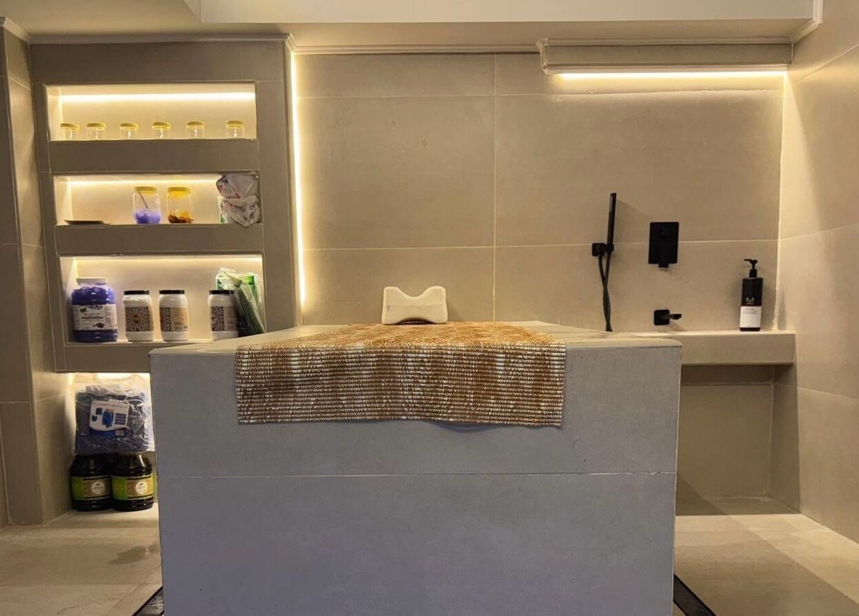 Modern treatment room at Classy Salon, Ajman, AE, featuring sleek shelves with beauty products.