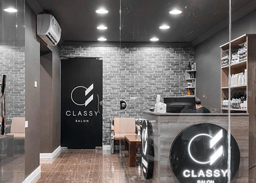 Elegant interior of Classy Salon reception in Ajman, Ajman, AE with modern decor and lighting.