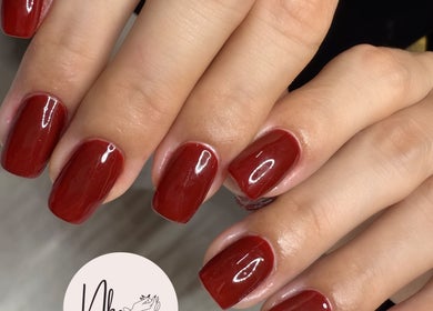 Elegant glossy red manicure at Nails By Nks, located in Phnom Penh, Phnom Penh, KH.