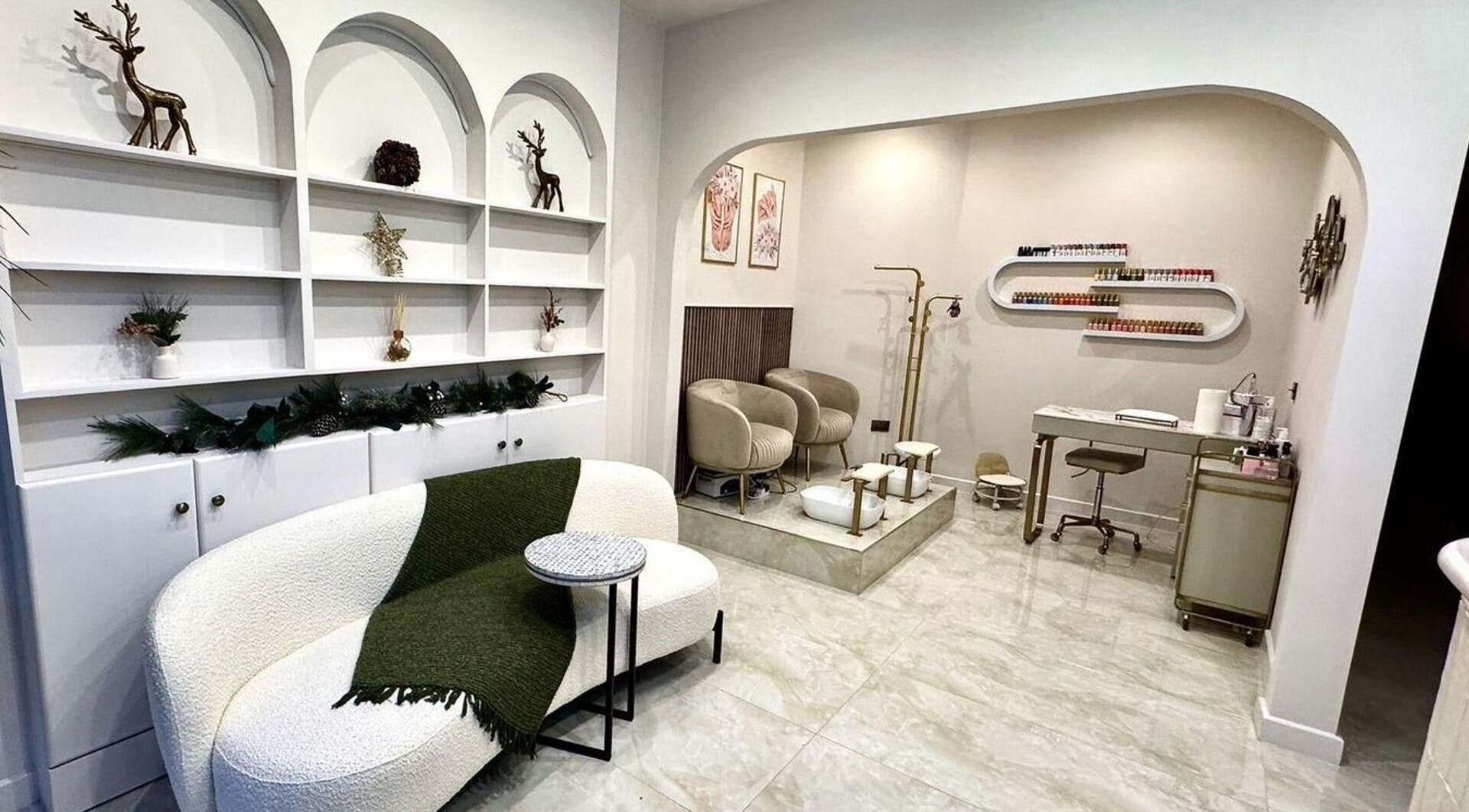 Cozy beauty lounge setup at Shefa Beauty Lounge, London, England, GB. Features elegant seating and decor.