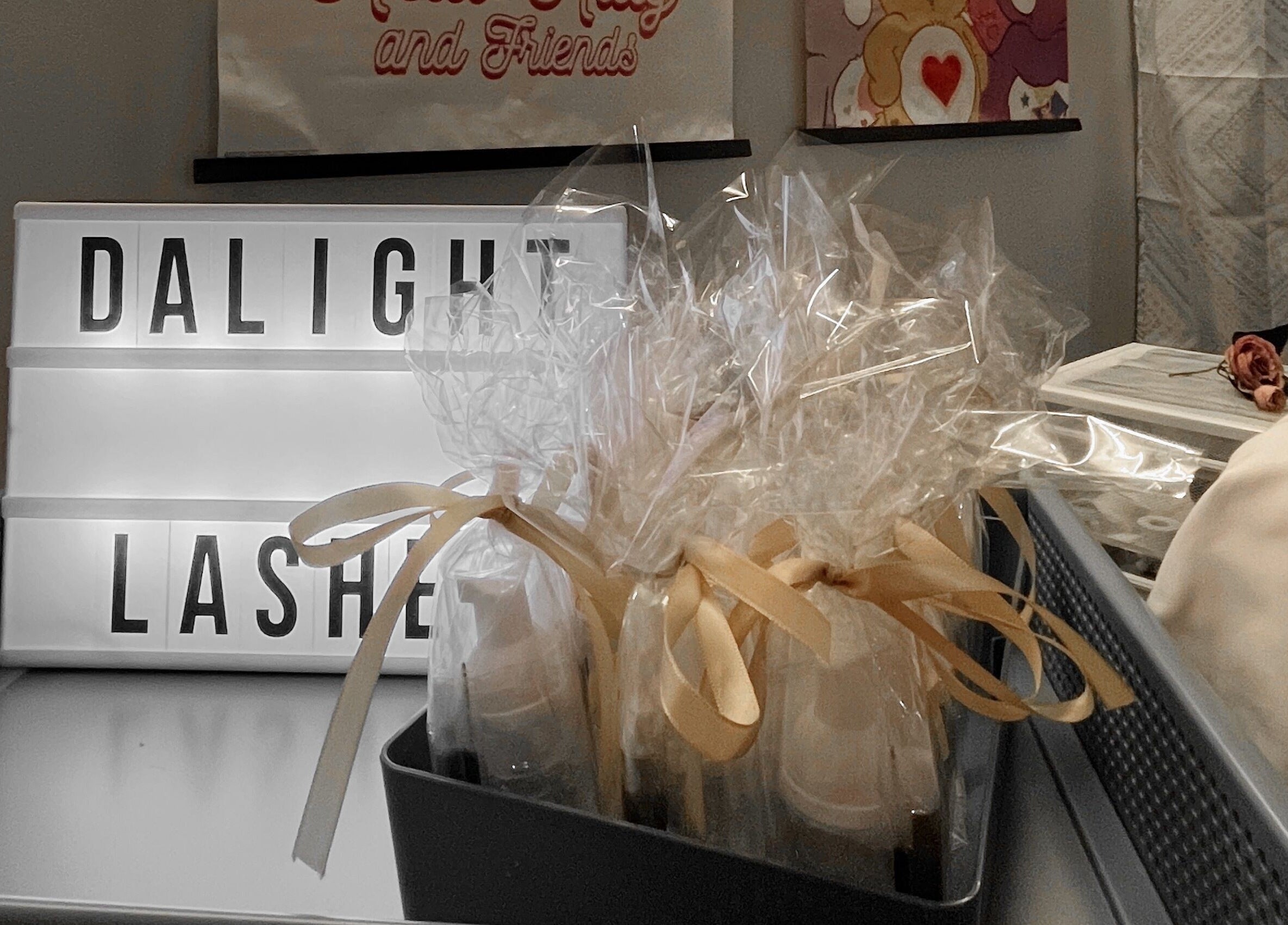 Dalight Lashes decor and gift display in Winnipeg, Manitoba, CA, showcasing elegant ribbon-wrapped items.