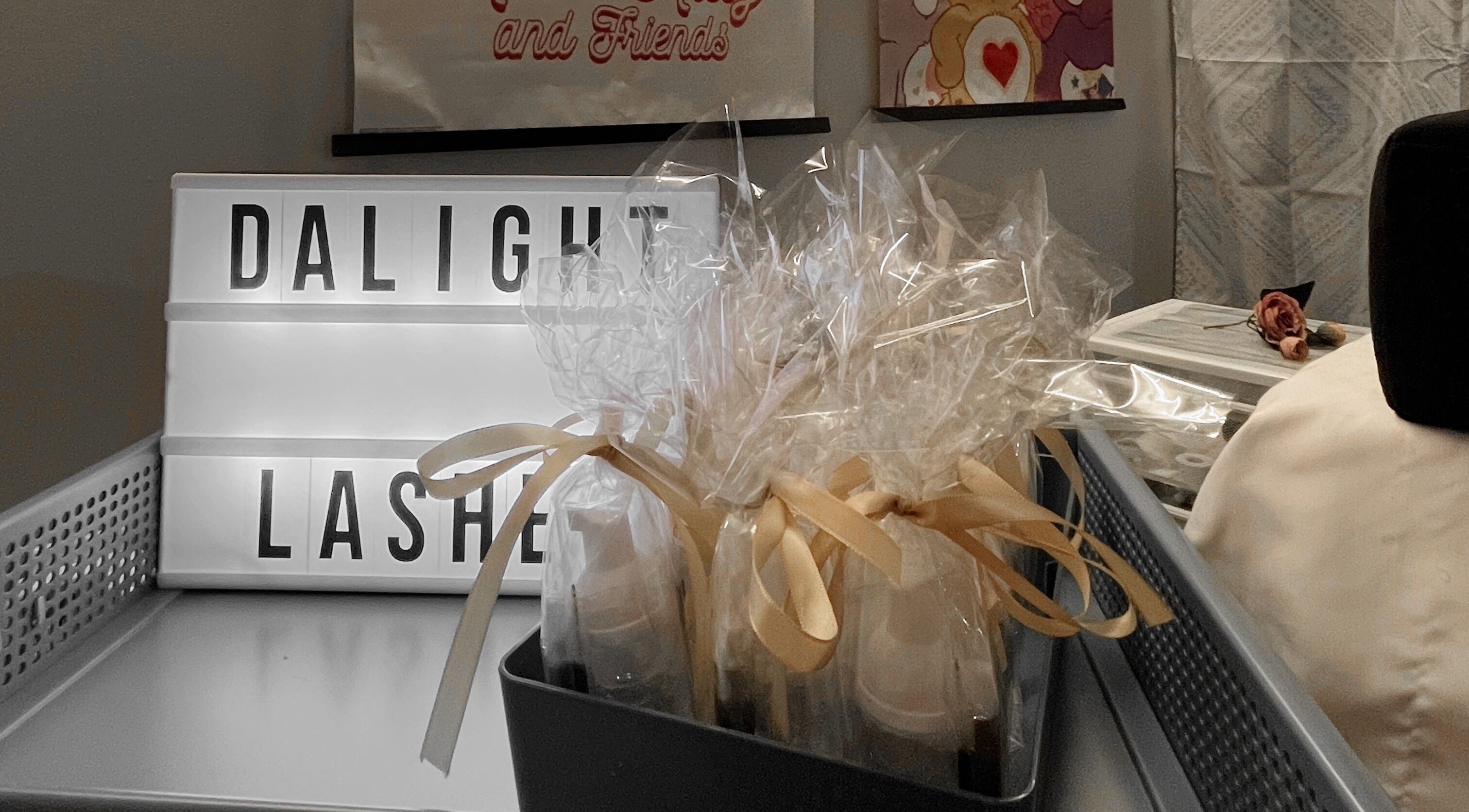 Dalight Lashes decor and gift display in Winnipeg, Manitoba, CA, showcasing elegant ribbon-wrapped items.