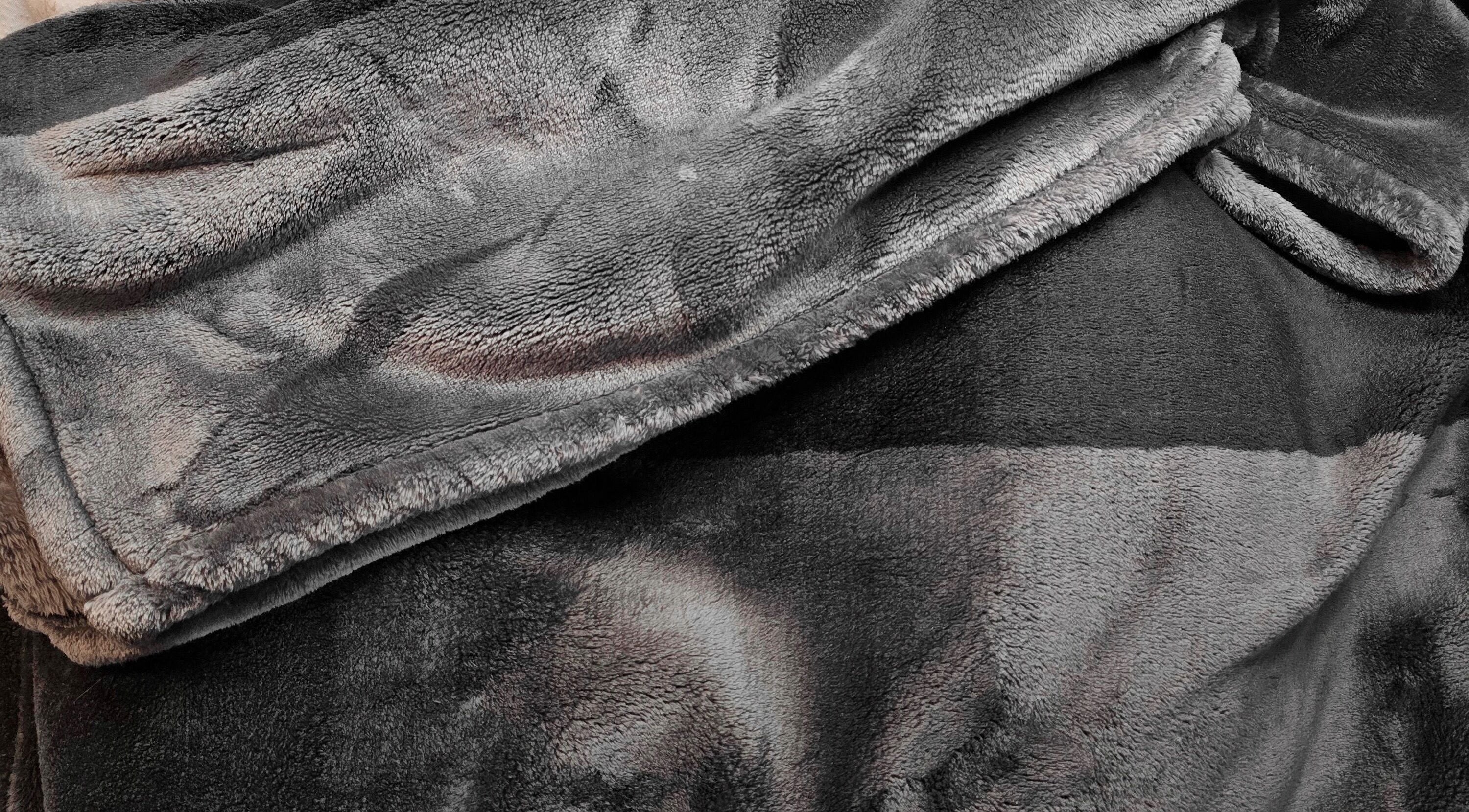 Plush grey blanket at Dalight Lashes, Winnipeg, Manitoba, CA offering maximum comfort and relaxation.