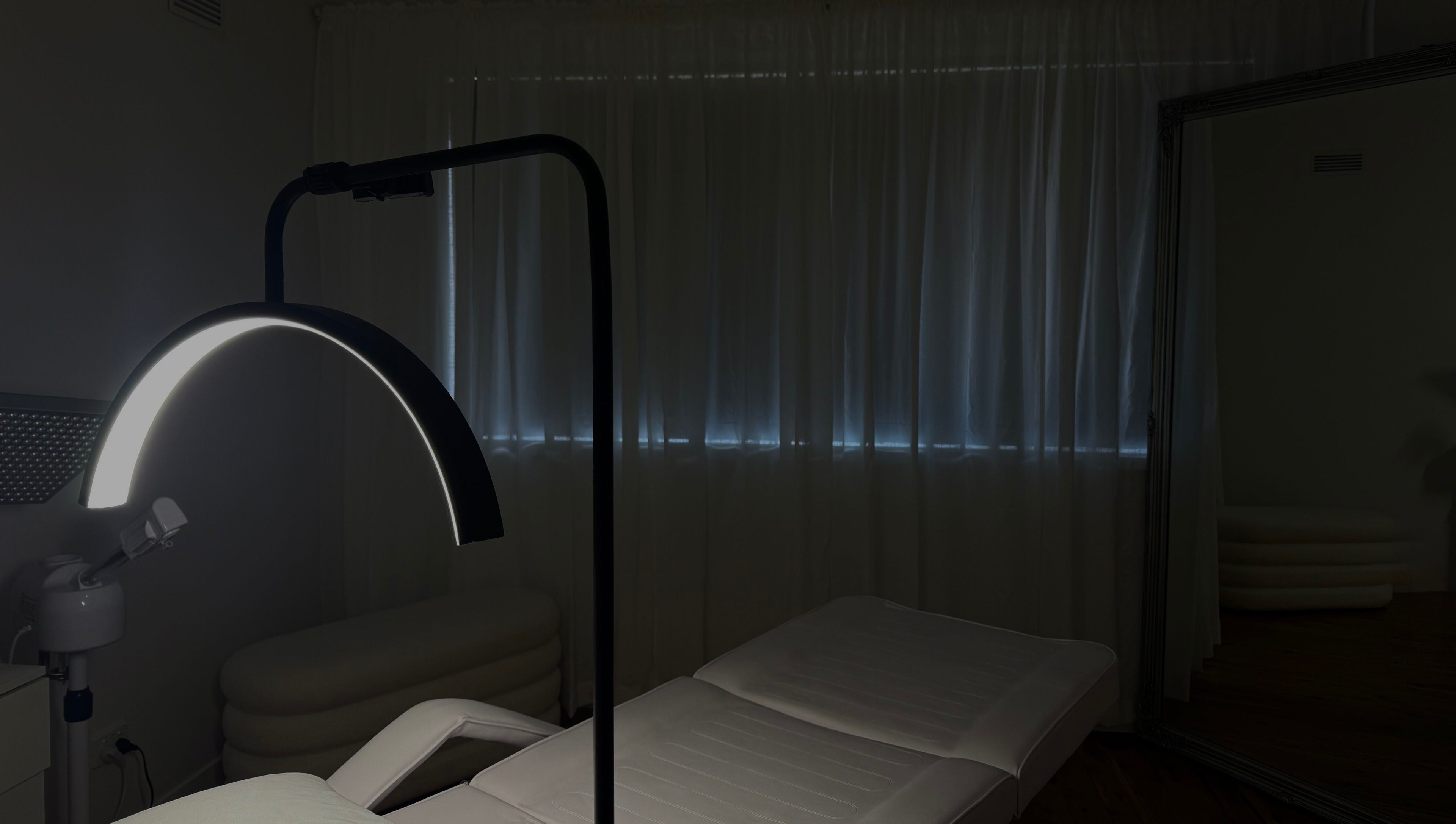 Calm spa room at Genesis GloMed, Toongabbie, New South Wales, AU, featuring a treatment bed and soft lighting.