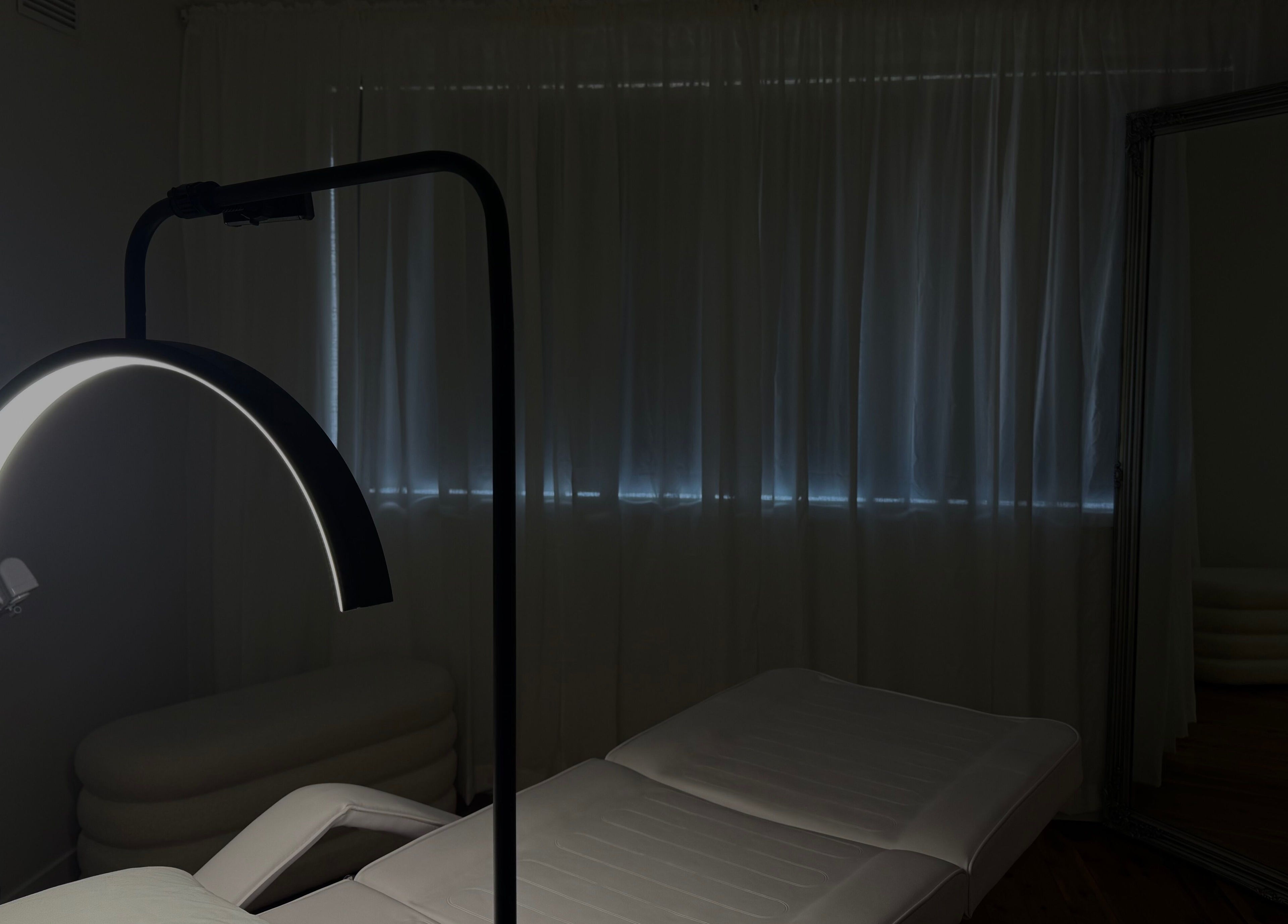 Calm spa room at Genesis GloMed, Toongabbie, New South Wales, AU, featuring a treatment bed and soft lighting.