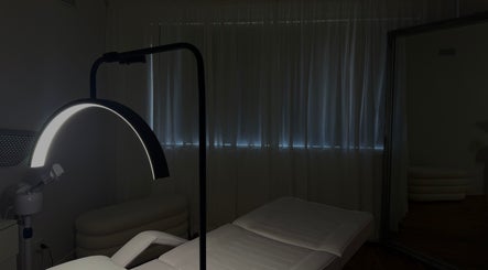 Calm spa room at Genesis GloMed, Toongabbie, New South Wales, AU, featuring a treatment bed and soft lighting.