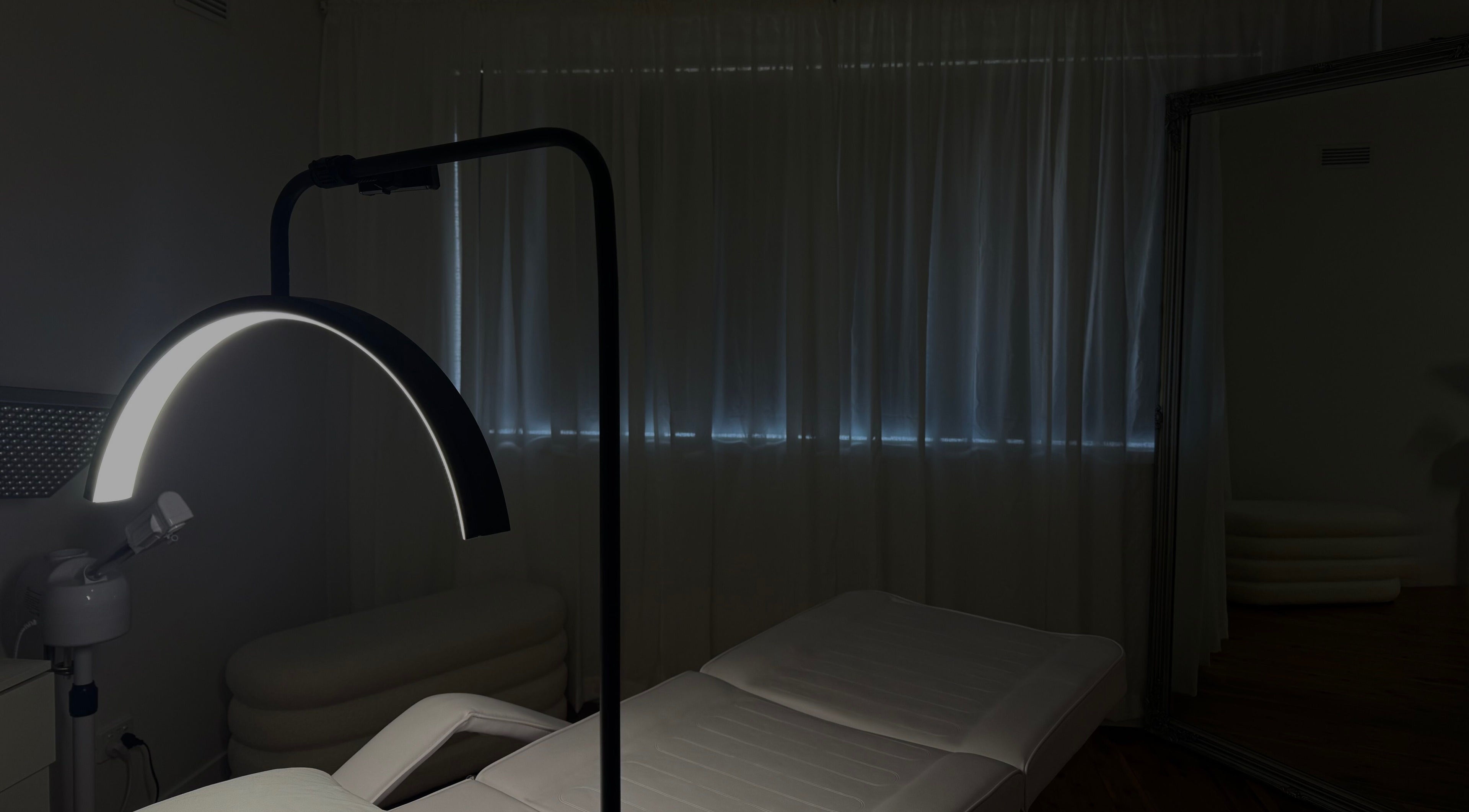 Calm spa room at Genesis GloMed, Toongabbie, New South Wales, AU, featuring a treatment bed and soft lighting.