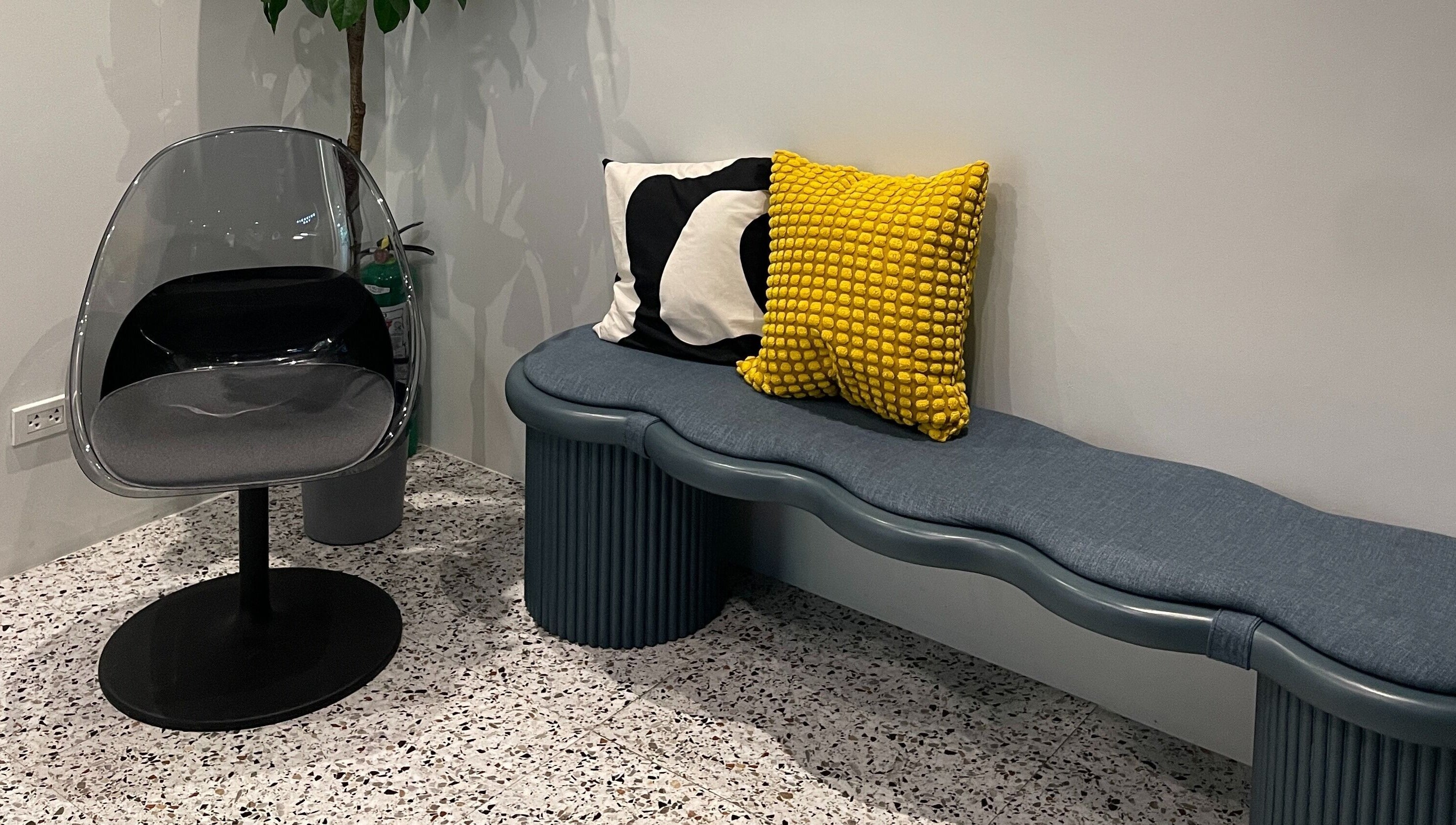 Modern seating area at Piercing Day, Taguig, Metro Manila, PH with stylish chairs and cushions.
