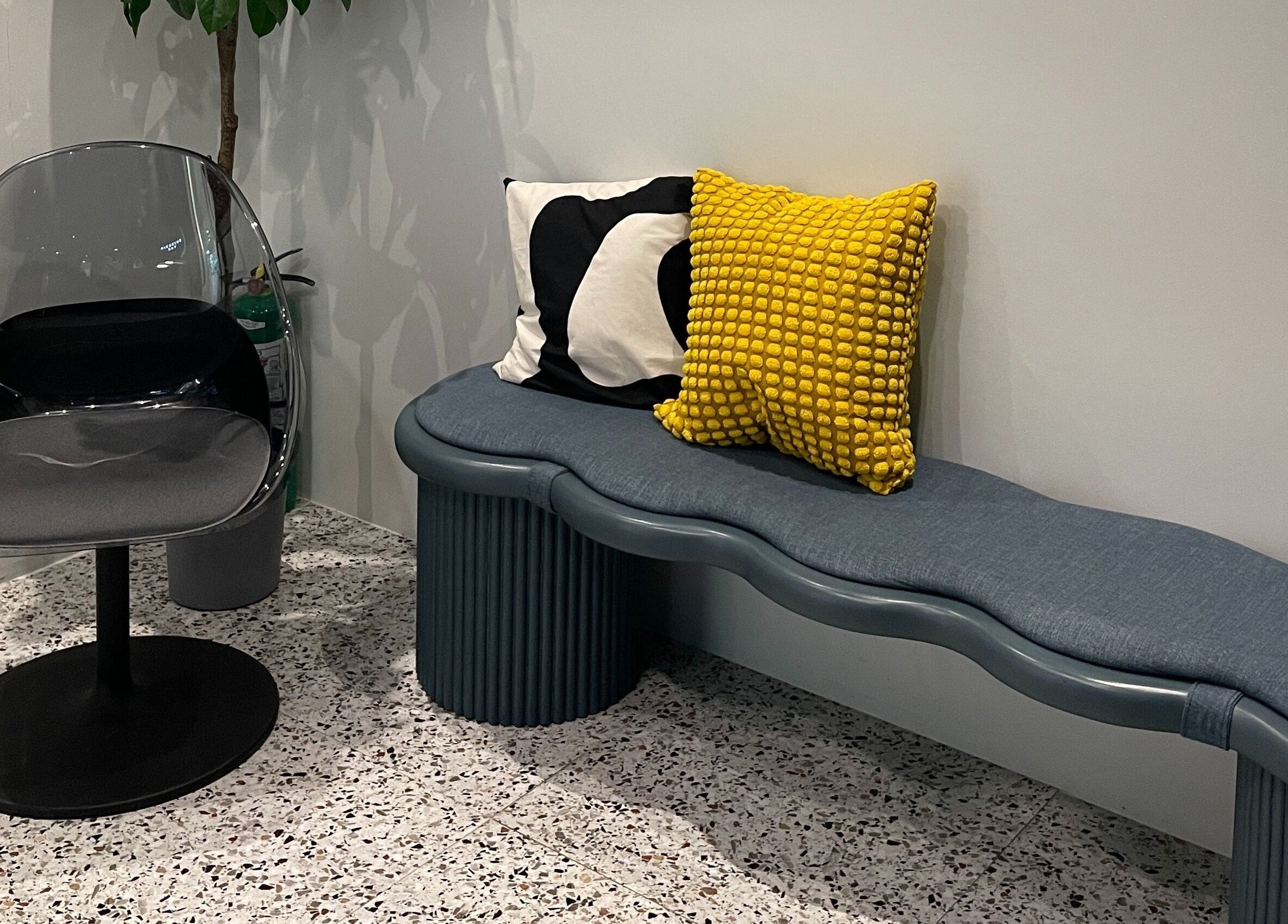 Modern seating area at Piercing Day, Taguig, Metro Manila, PH with stylish chairs and cushions.