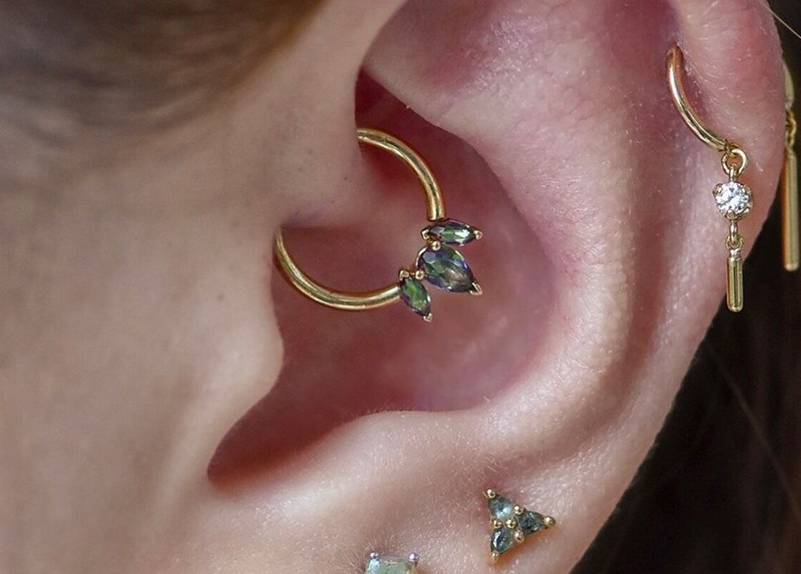 Stylish ear piercings with gems at Piercing Day, Taguig, Metro Manila, PH showcasing unique jewelry.