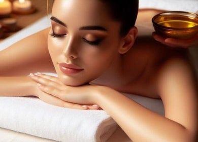 Relaxed woman receiving massage at ZOLA B2B WITH HAPPYENDING SPA, Bengaluru, Karnataka, IN.