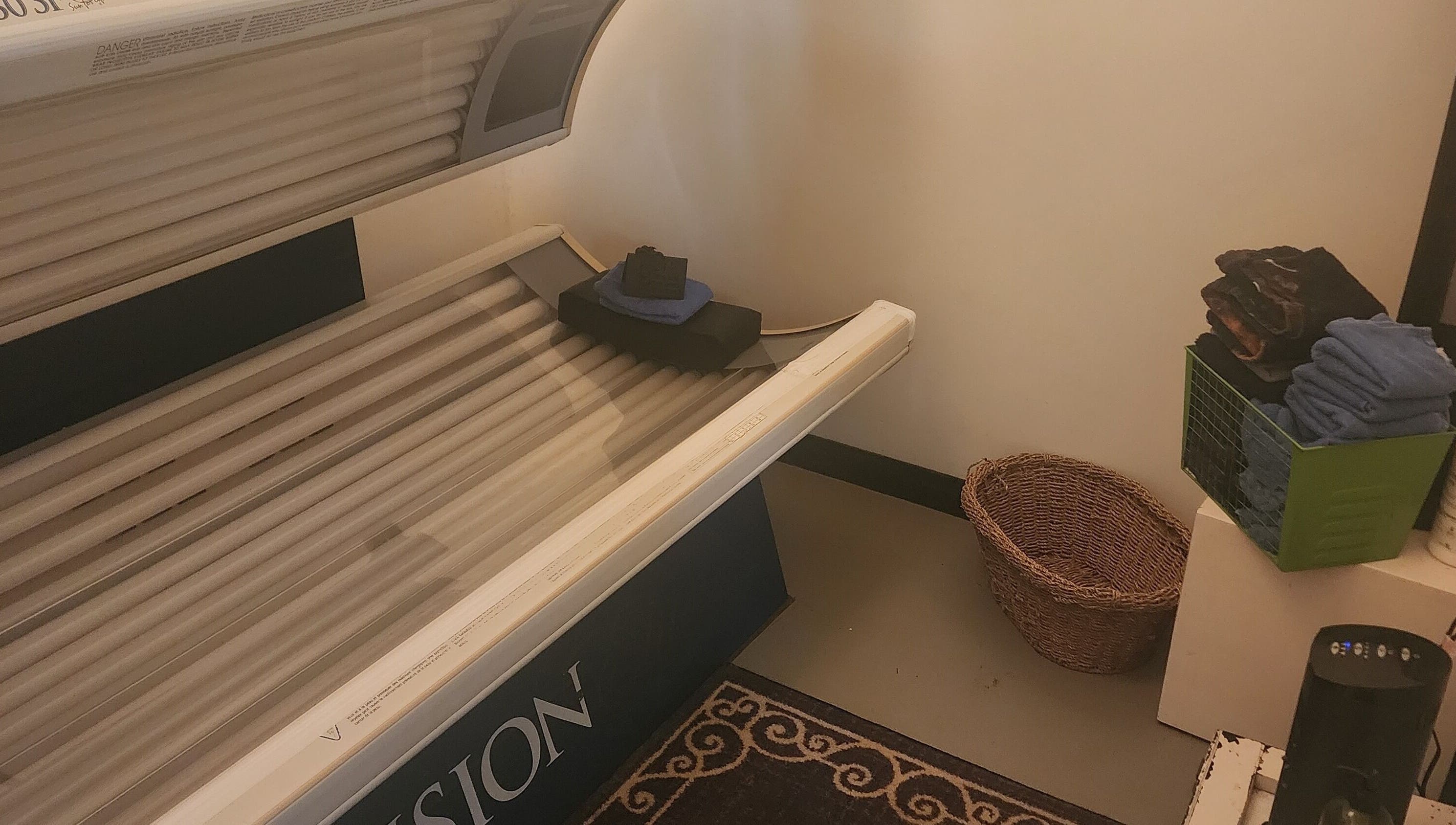 Tanning bed at Divine Salon and Spa in Langdon, Alberta, CA, offers a relaxing sun-kissed experience.