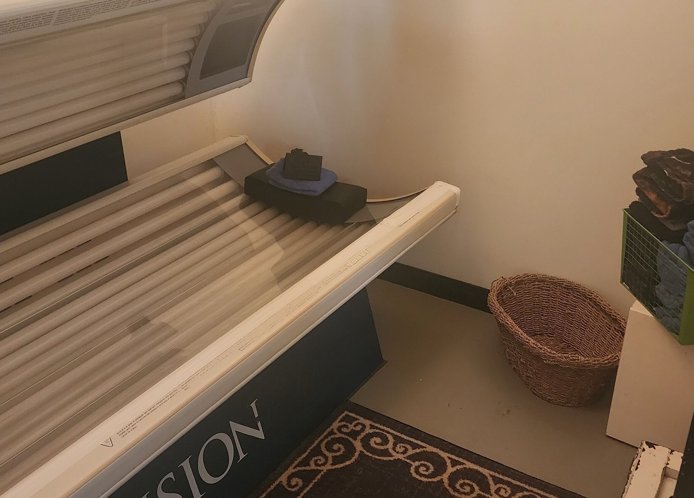 Tanning bed at Divine Salon and Spa in Langdon, Alberta, CA, offers a relaxing sun-kissed experience.