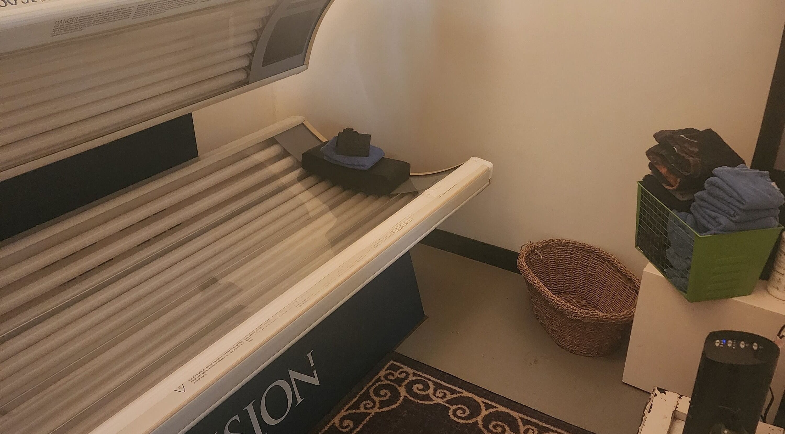 Tanning bed at Divine Salon and Spa in Langdon, Alberta, CA, offers a relaxing sun-kissed experience.