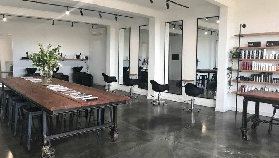 Modern interior of HQ Salon and Beauty in Aspendale, Victoria, AU with styling chairs and product shelves.
