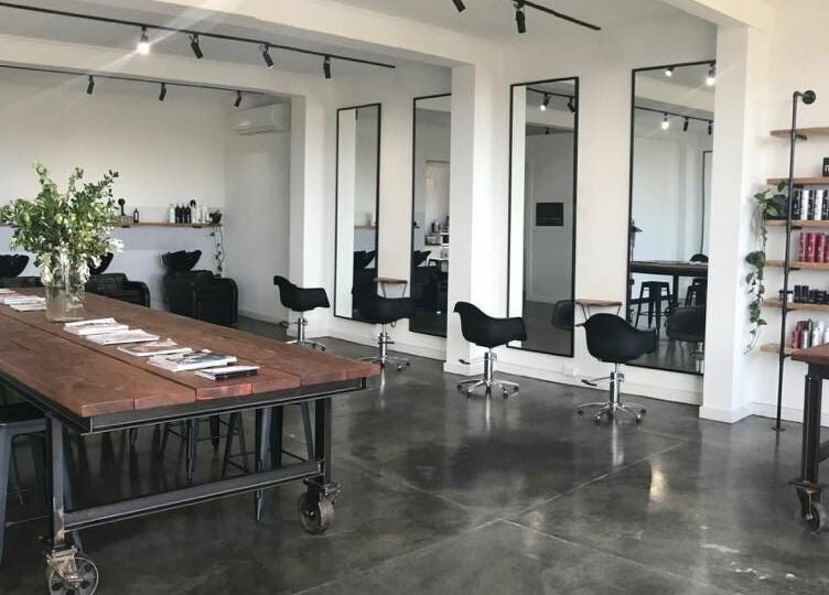 Modern interior of HQ Salon and Beauty in Aspendale, Victoria, AU with styling chairs and product shelves.