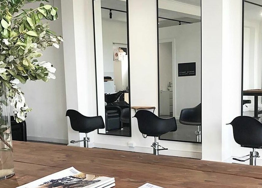Elegantly designed salon area at HQ Salon and Beauty, Aspendale, Victoria, AU with mirrors and chairs.