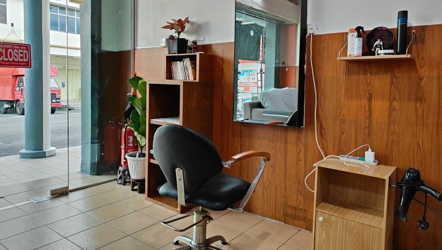Cozy salon interior with styling chair at 008 Hair & Beauty Studio, Ipoh, Perak, MY.
