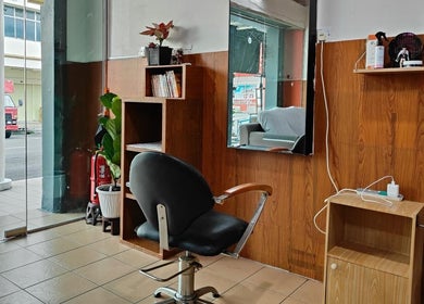 Cozy salon interior with styling chair at 008 Hair & Beauty Studio, Ipoh, Perak, MY.