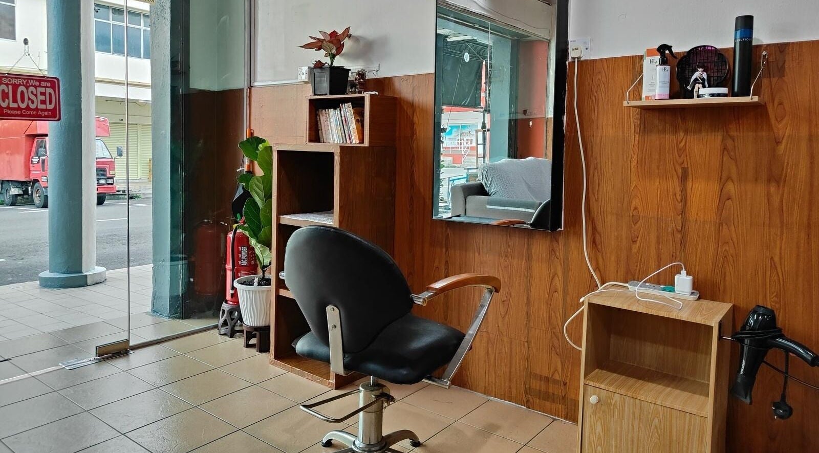 Cozy salon interior with styling chair at 008 Hair & Beauty Studio, Ipoh, Perak, MY.