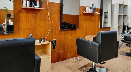Modern salon chairs at 008 Hair & Beauty Studio, Ipoh, Perak, MY, offering comfortable styling experience.