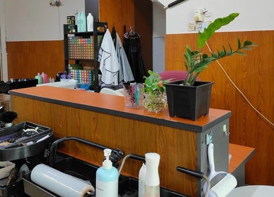 Reception area at 008 Hair & Beauty Studio, Ipoh, Perak, MY, showcasing tools and decor elements.