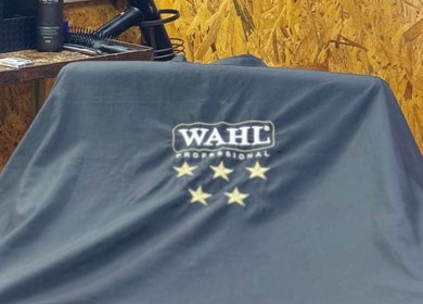 Aididthebarber in Klang, Selangor, MY showcases a professional barber chair covered with a Wahl cover.
