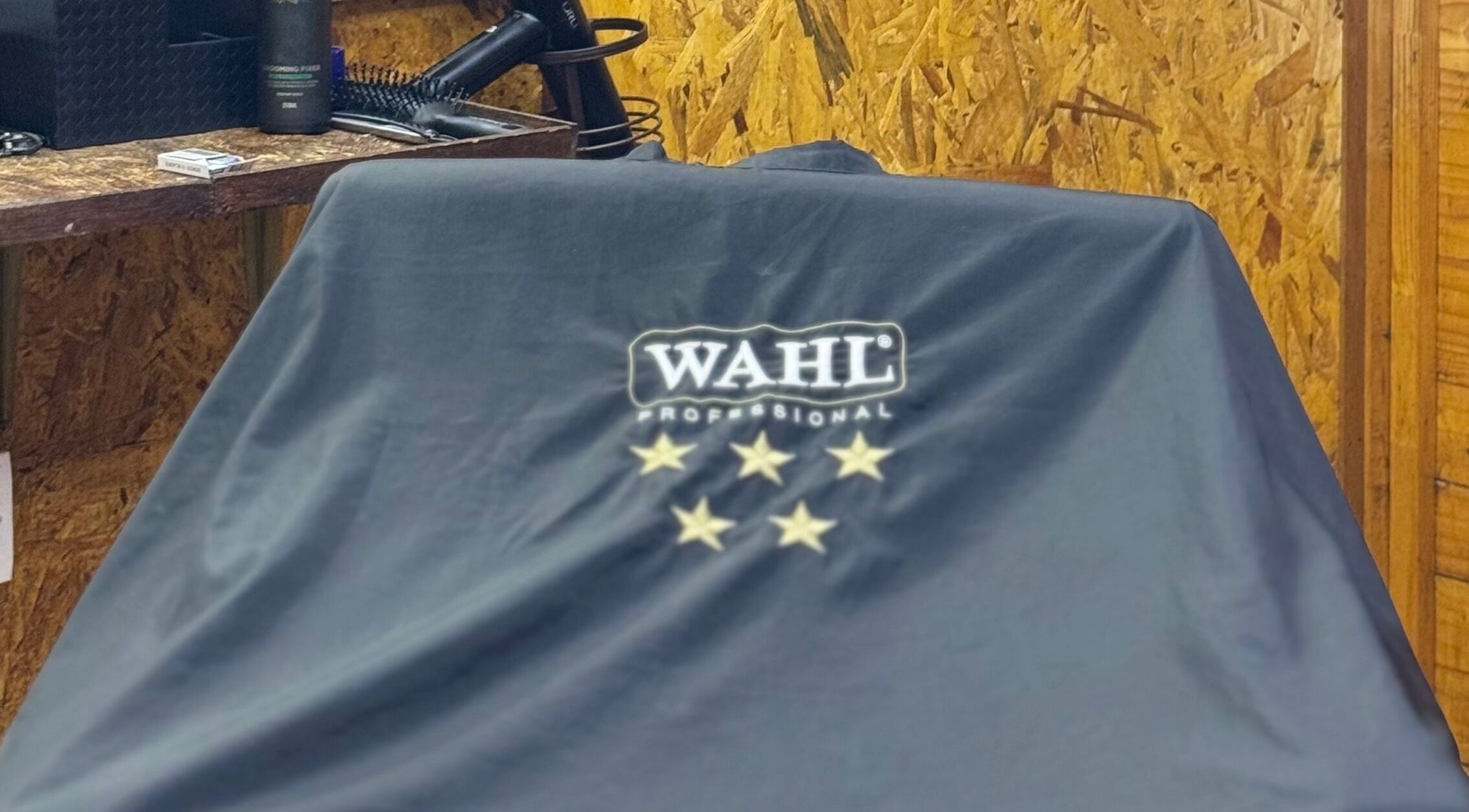 Barber chair covered with protective cloth at Aididthebarber, Klang, Selangor, MY.