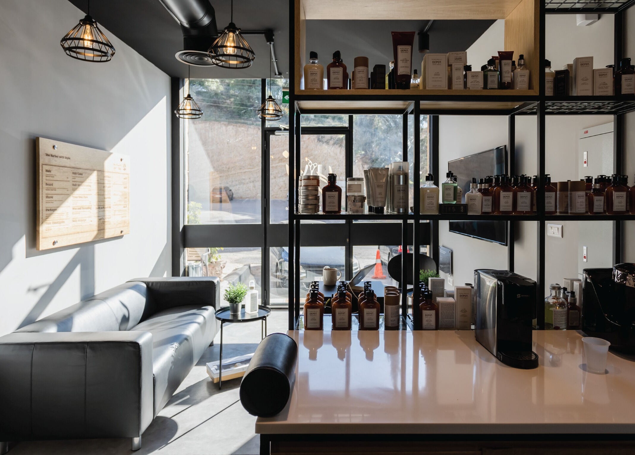 Stylish interior of Yousef Afandi - Ghirnatah | يوسف أفندي - غرناطة in Riyadh, featuring sleek seating and products.