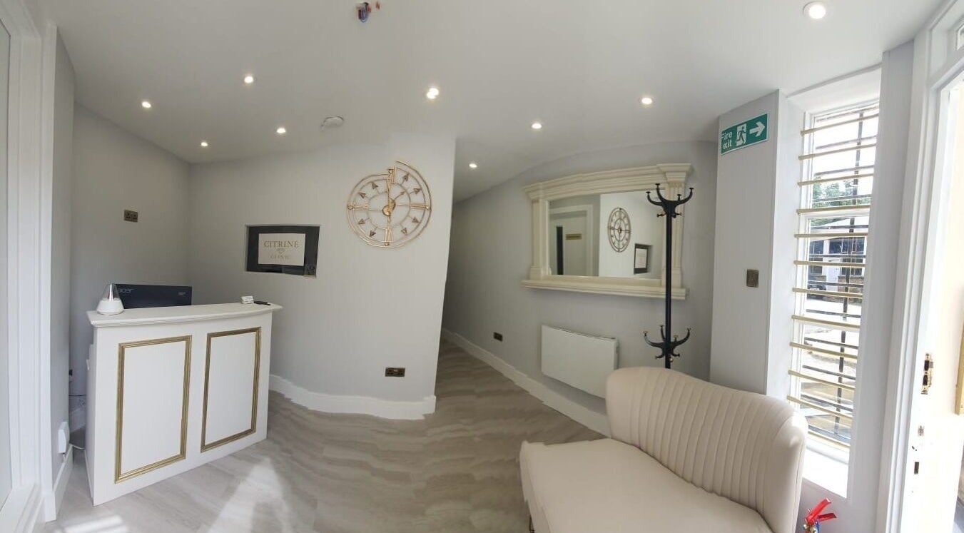 Welcoming reception area in Citrine Clinic, Ilford, England, GB, featuring elegant decor and comfortable seating.