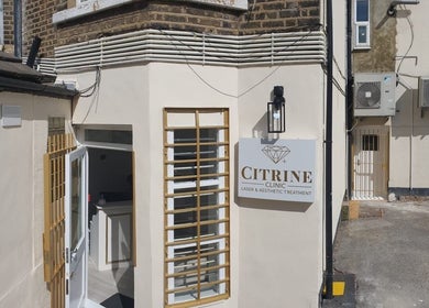 Entrance to Citrine Clinic in Ilford, England, GB with signage and open door.