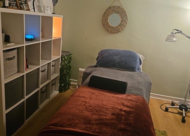Pure Acupuncture NI's Tranquillity Room in Lisburn, Northern Ireland features a cozy and calming therapy space.
