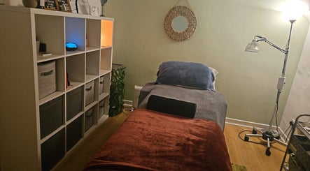 Pure Acupuncture NI's Tranquillity Room in Lisburn, Northern Ireland features a cozy and calming therapy space.