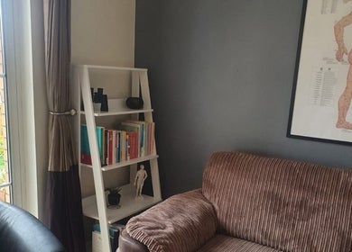 Cozy corner at Pure Acupuncture NI - The Tranquillity Room, Lisburn with books and decor, Lisburn, Northern Ireland, GB.