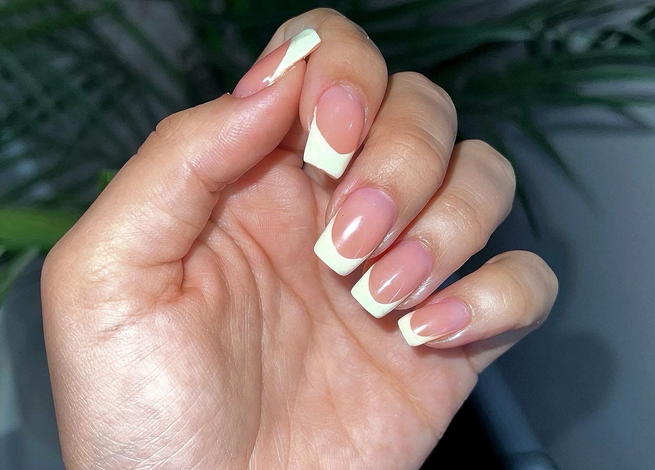Close-up of elegant French manicure at Kerisbeauty, Swindon, England, GB showcasing refined nail art.
