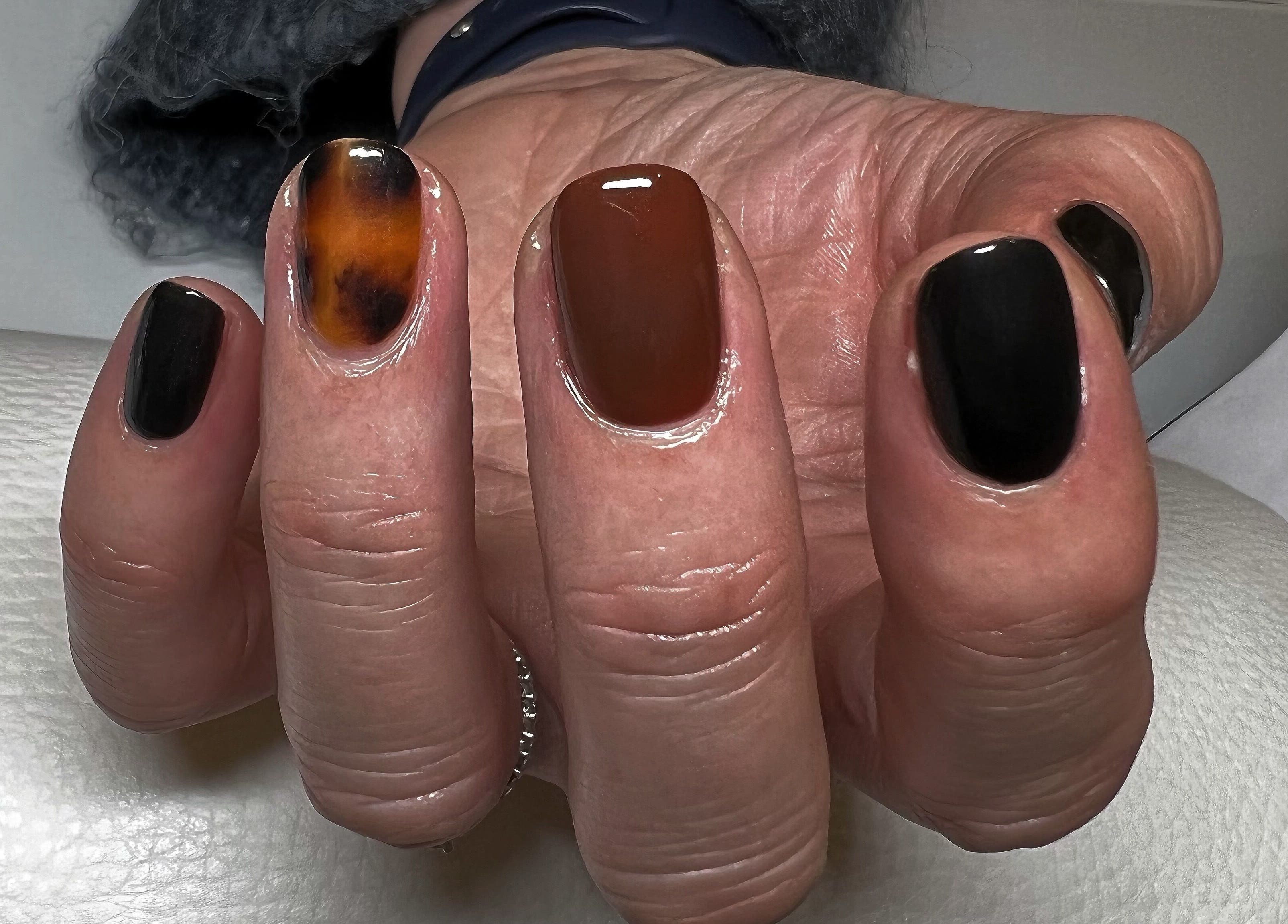 Stylish brown and black nail design at Kerisbeauty in Swindon, England, GB.