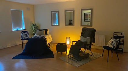 Calming therapy room at Celestial Blessings Therapy, Newport, County Tipperary, IE with soft lighting and cozy seating.