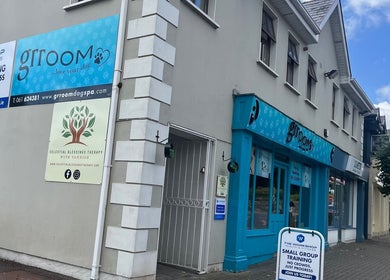 Exterior view of Celestial Blessings Therapy in Newport, County Tipperary, IE with vibrant storefronts.