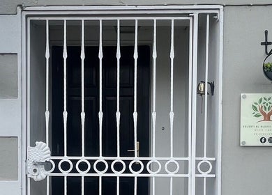 Entrance of Celestial Blessings Therapy in Newport, County Tipperary, IE, featuring a welcoming gate and signage.