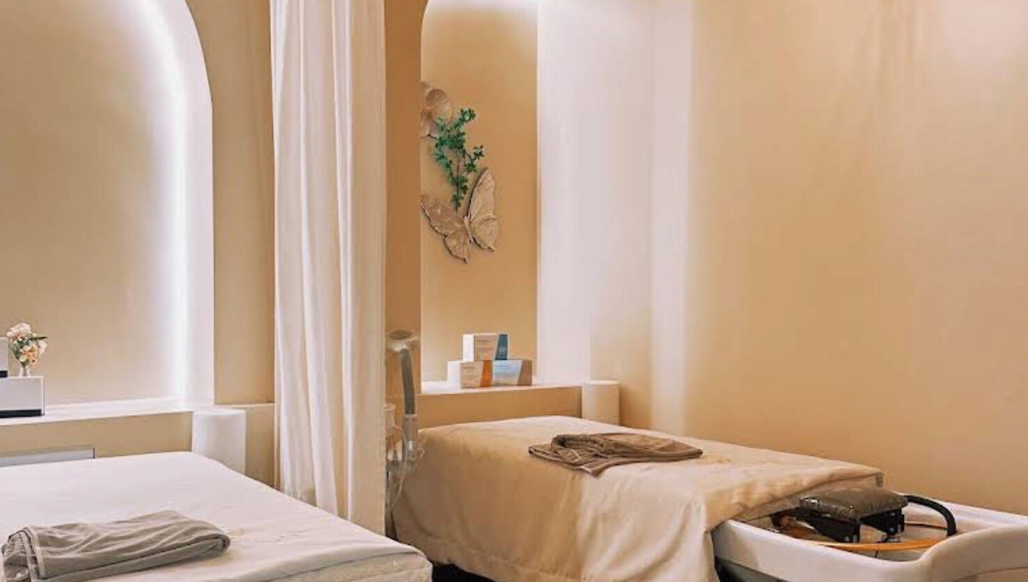 Tranquil spa room at SENA, New York, New York, US featuring two massage beds and calming ambiance.