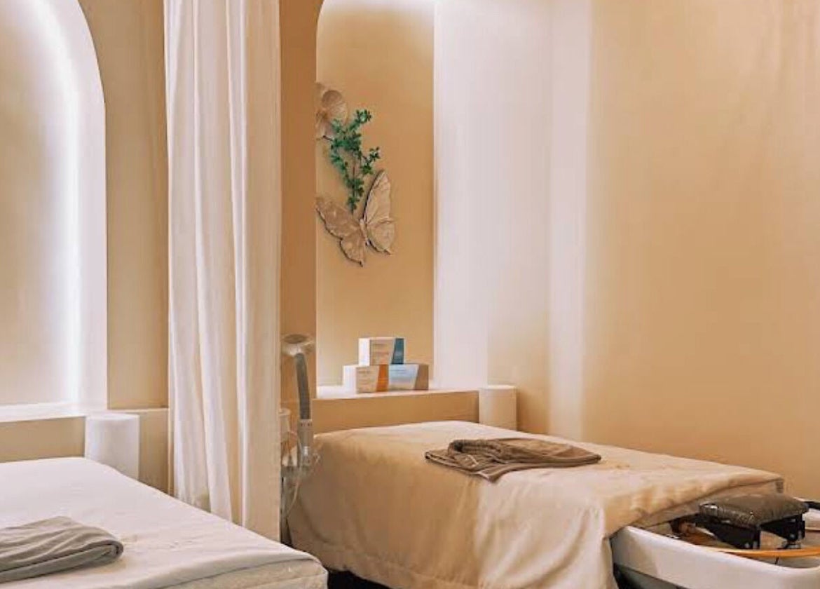 Tranquil spa room at SENA, New York, New York, US featuring two massage beds and calming ambiance.