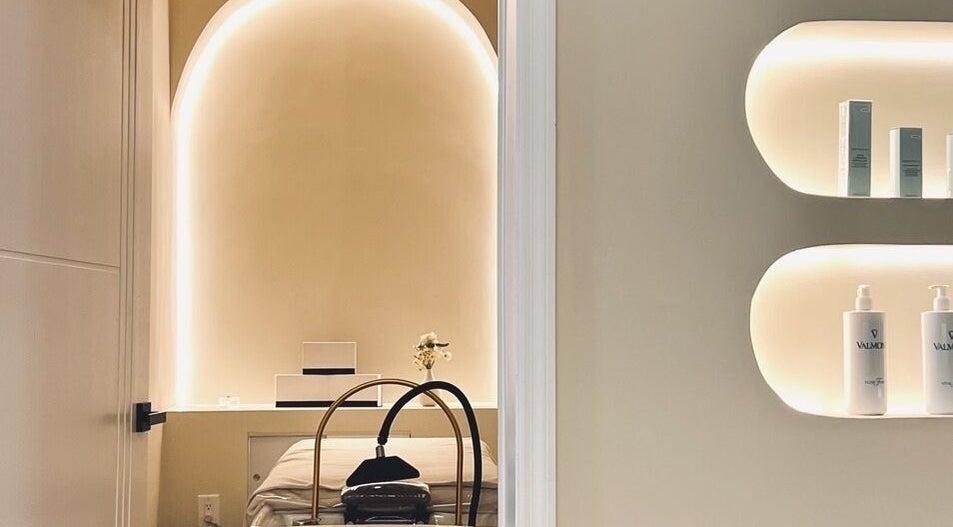 Tranquil treatment room at SENA, New York, New York, US, featuring ambient lighting and relaxing decor.