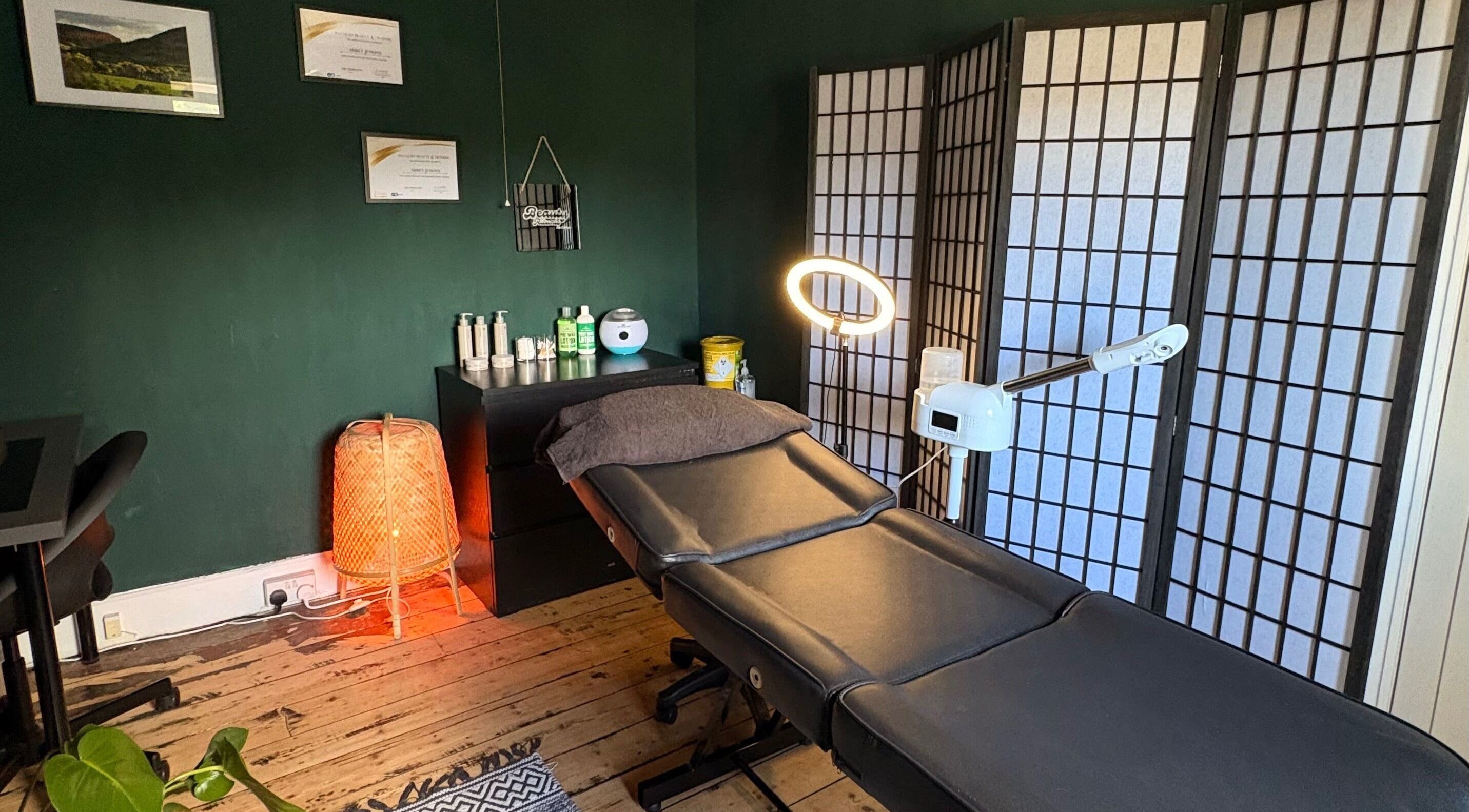 Relaxing therapy room at Beauty Rituals by Abbey, Abergavenny, Wales, GB with massage bed and warm lighting.