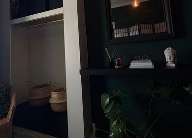 Tranquil interior of Beauty Rituals by Abbey in Abergavenny, Wales, GB with wicker chair and decor.