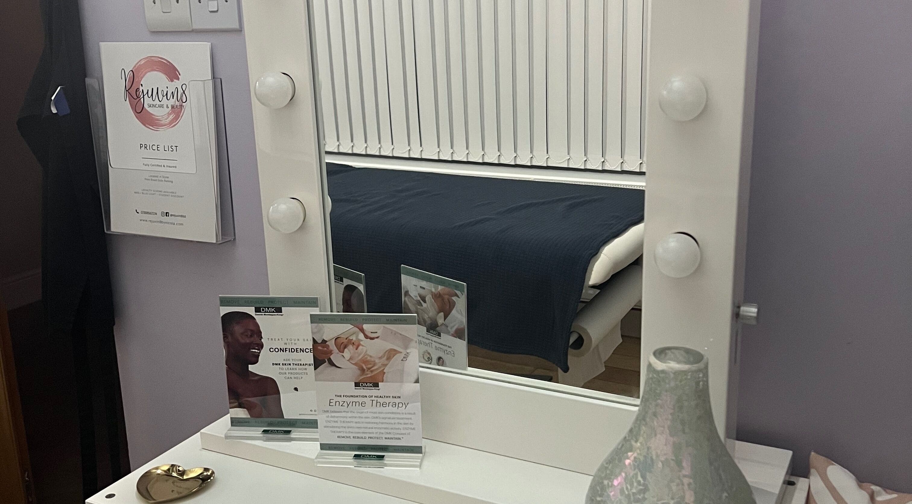 Rejuvin8 beauty station with mirror, price list, and therapy brochures in Slyne, England, GB.