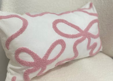 Cushion with pink textured design at BROWS BABE, Melbourne, Victoria, AU enhances relaxation vibe.