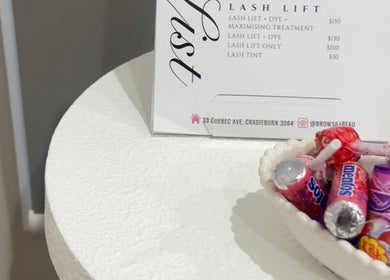 Close-up of BROWS BABE's tasteful candy display in Melbourne, Victoria, AU, featuring signature service menu.